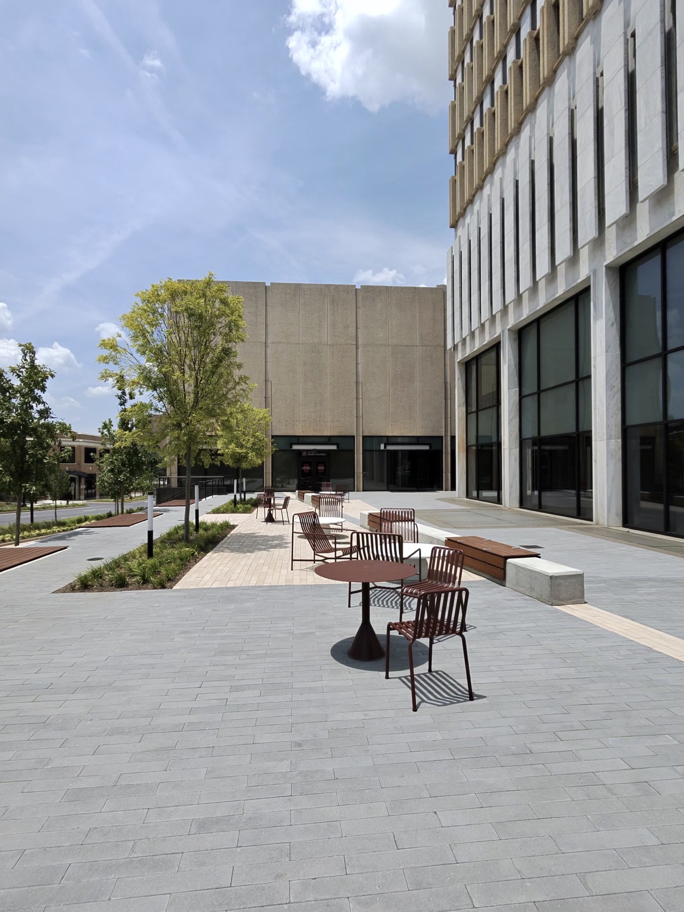 Outdoor tables and landscaping beside Coffee House